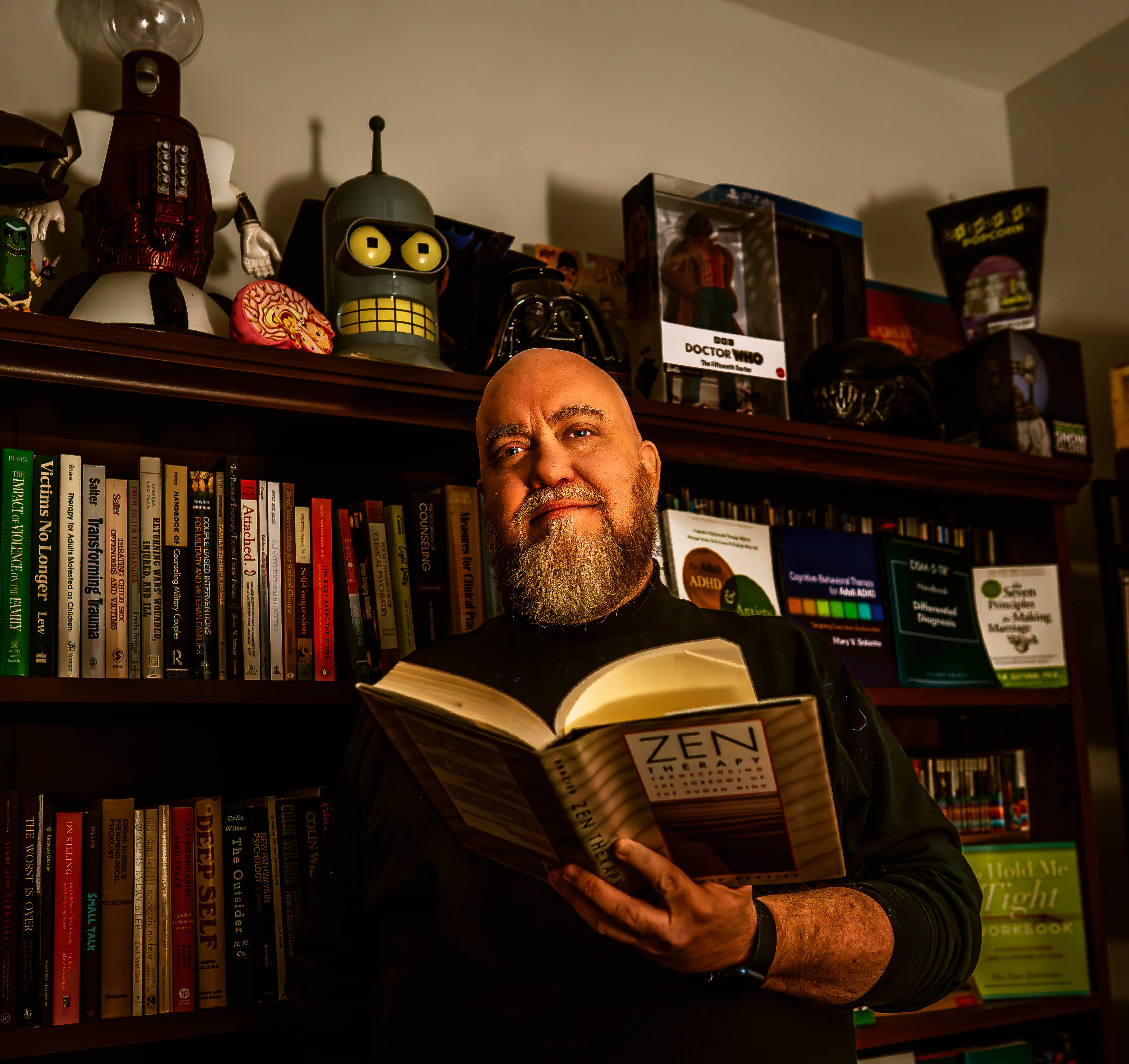 Man reading book in library