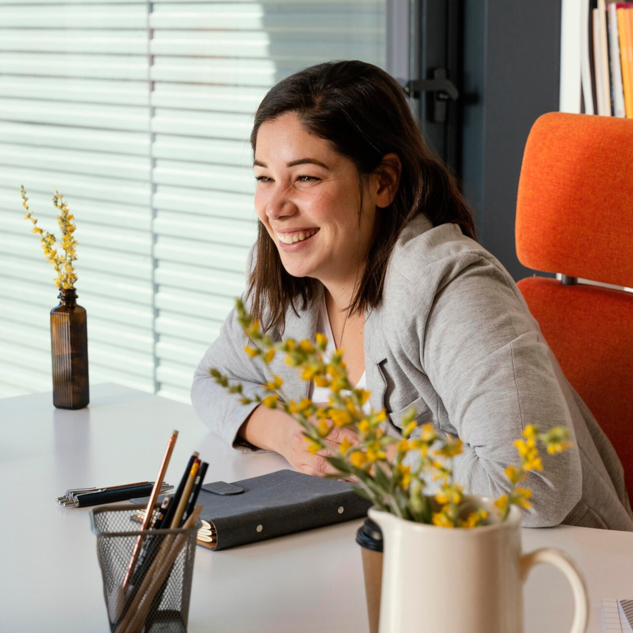 Smiling woman at a desk