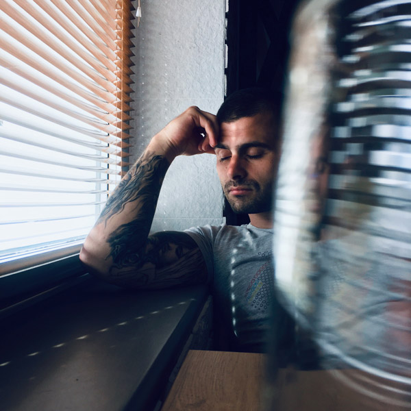 man thinking window