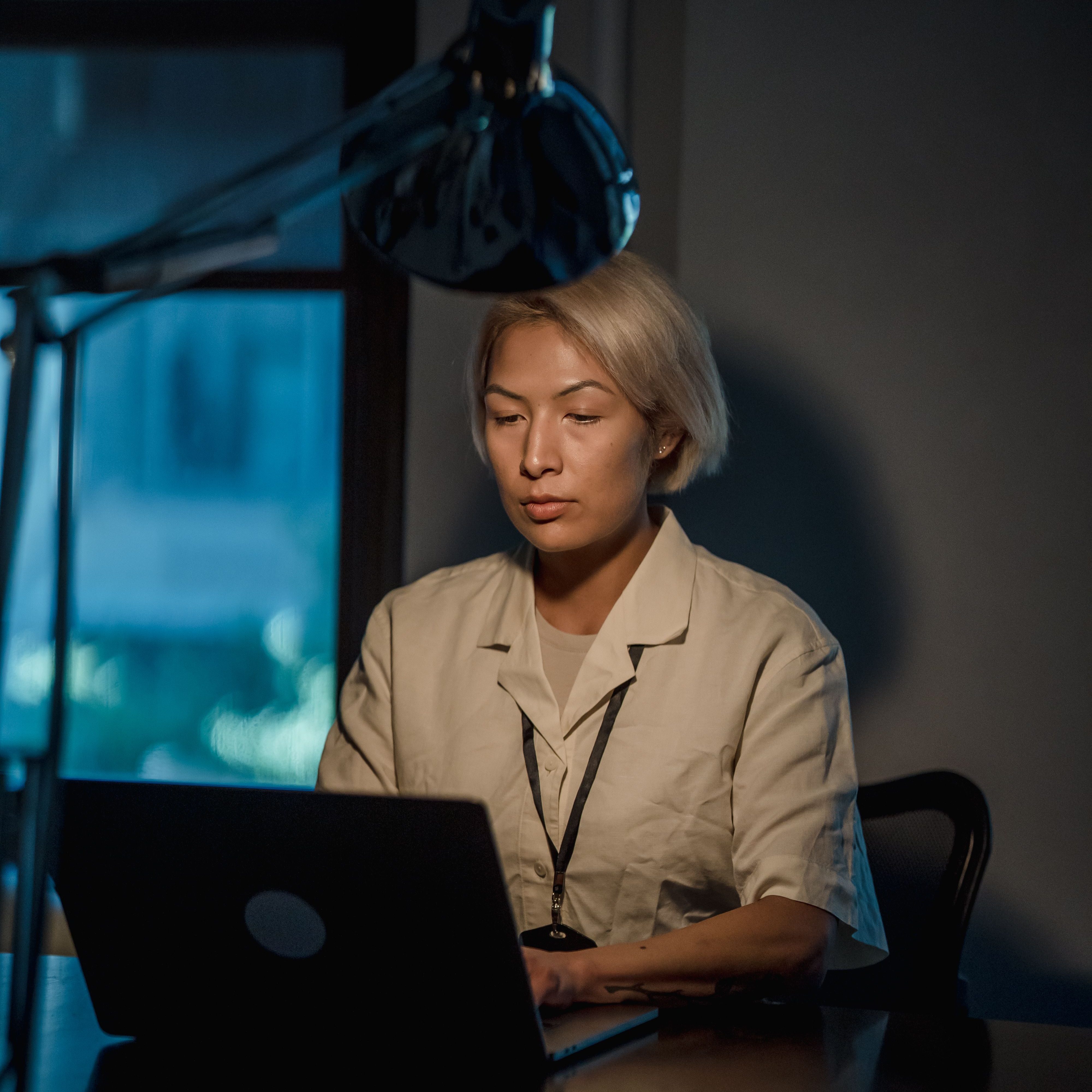 woman laptop lamp night